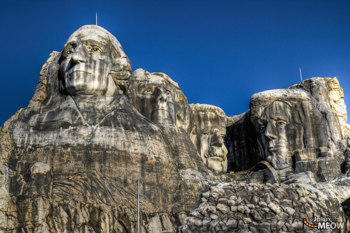 Abandoned Western Village theme park in Tochigi, Japan: eerie charm, dilapidated buildings, weathered Mount Rushmore replica.