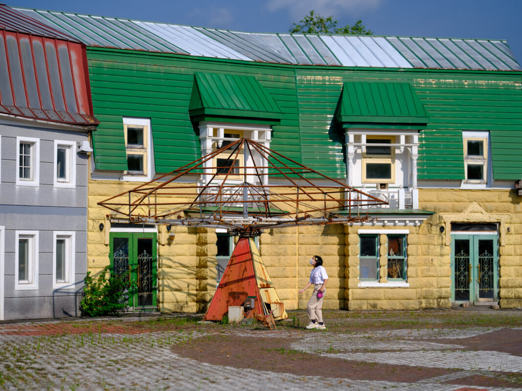 Whimsical Canadian village replica with vibrant buildings and unique pyramid-shaped structure.