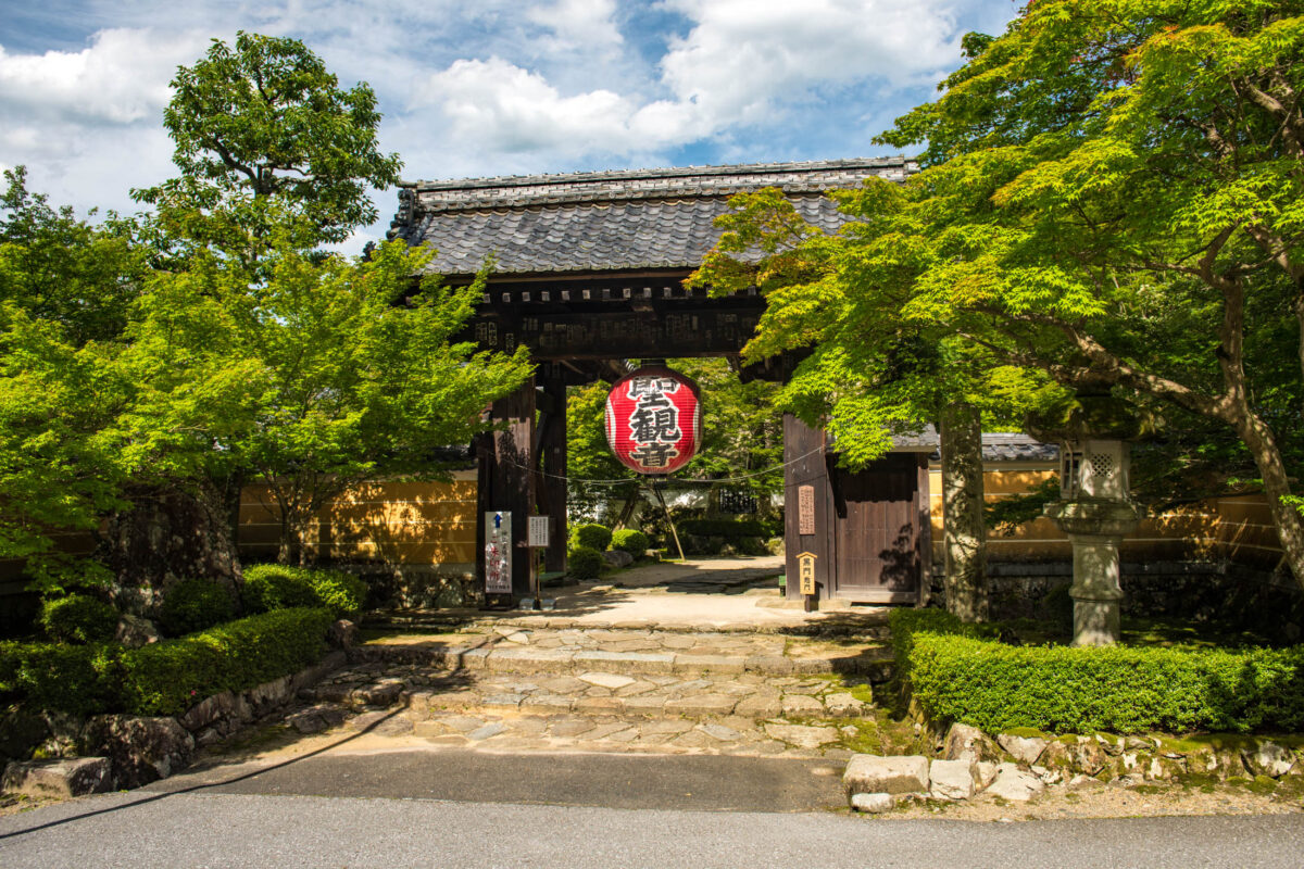 Kongōrin-ji Temple entrance gate with red lantern and stone path in Shiga, Japan.