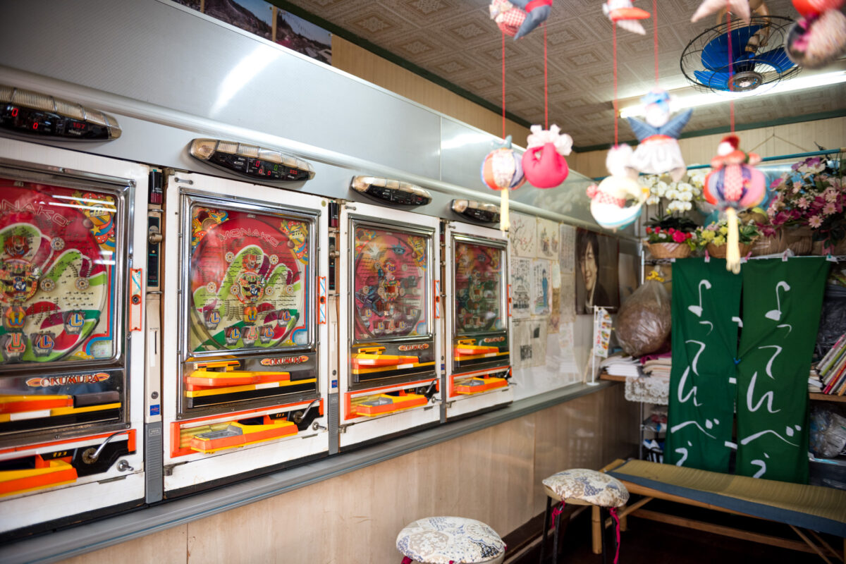 Vintage pachinko machines and stools in Sekizenkan Ryokan retro arcade room