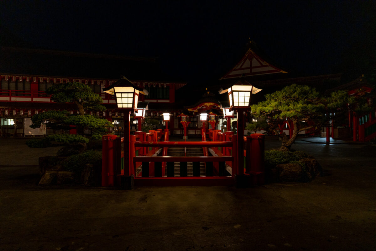 Lantern-lit red bridge at Taikodani Inari-jinja Shrine at night, Japan